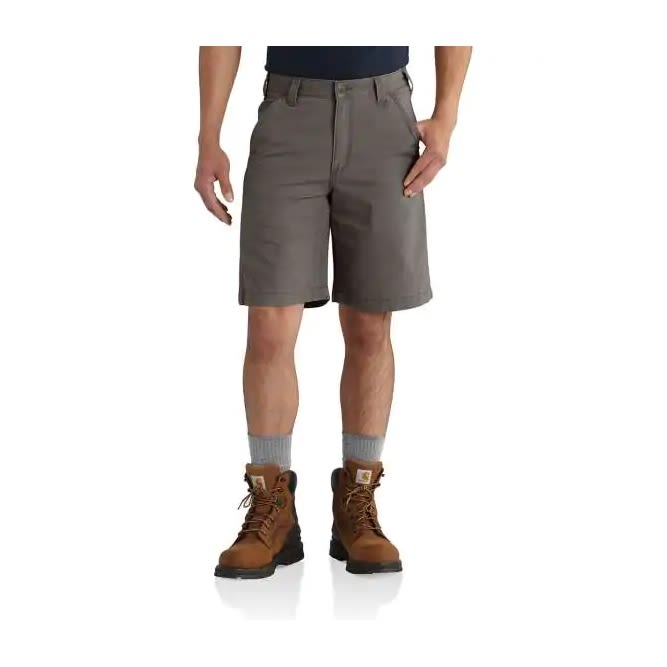 Men's rugged flex canvas shorts in neutral tone paired with work boots for clothing and shorts collection under $100