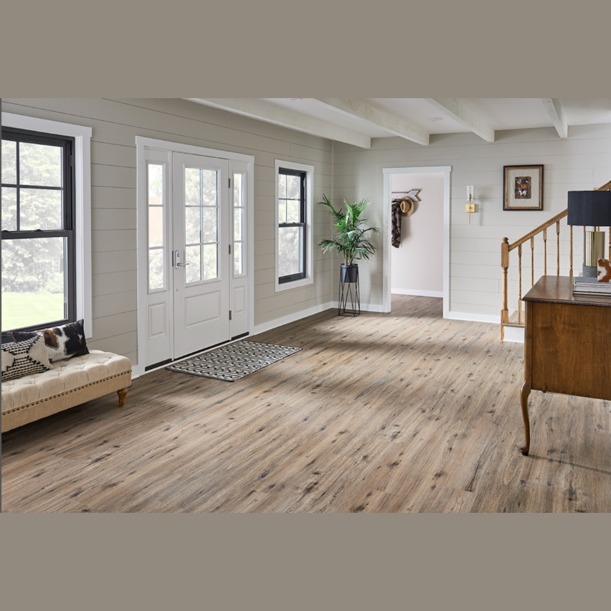 Spacious living area featuring MS International luxury vinyl flooring planks with natural wood grain tones and durable design