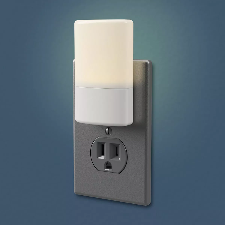 White dusk to dawn LED night light with Madison shade and sealed lens for soft warm glow in lighting and electrical collections