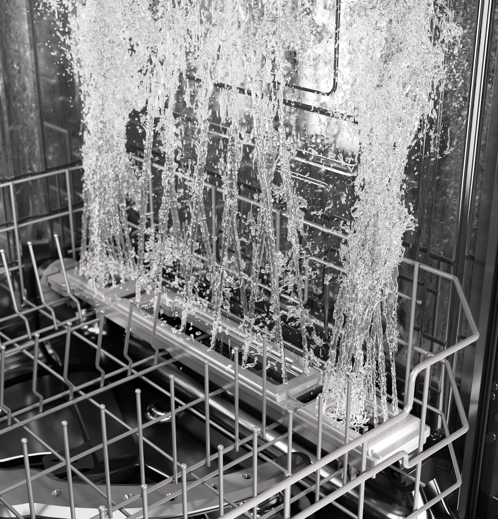 Close-up of water jets spraying inside stainless steel dishwasher rack in Dishwashers and Kitchen appliances collection