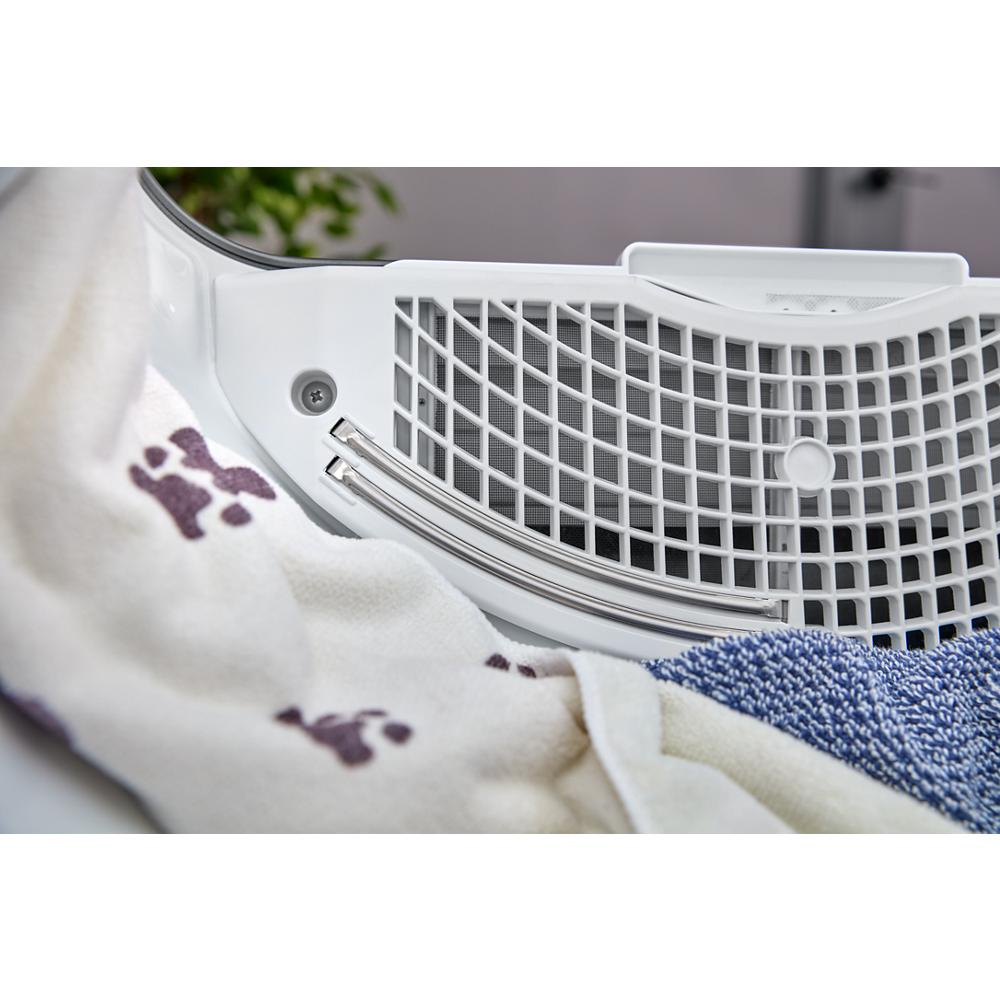 Close-up of lint trap with pet hair capture feature inside white top load electric dryer in home appliances collection
