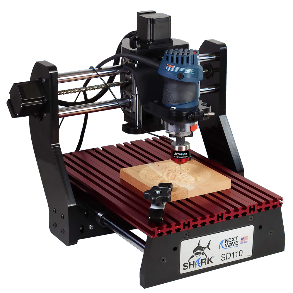 Compact CNC router with mounted blue motor carving detailed wooden panel on red aluminum slotted bed for woodworking tools