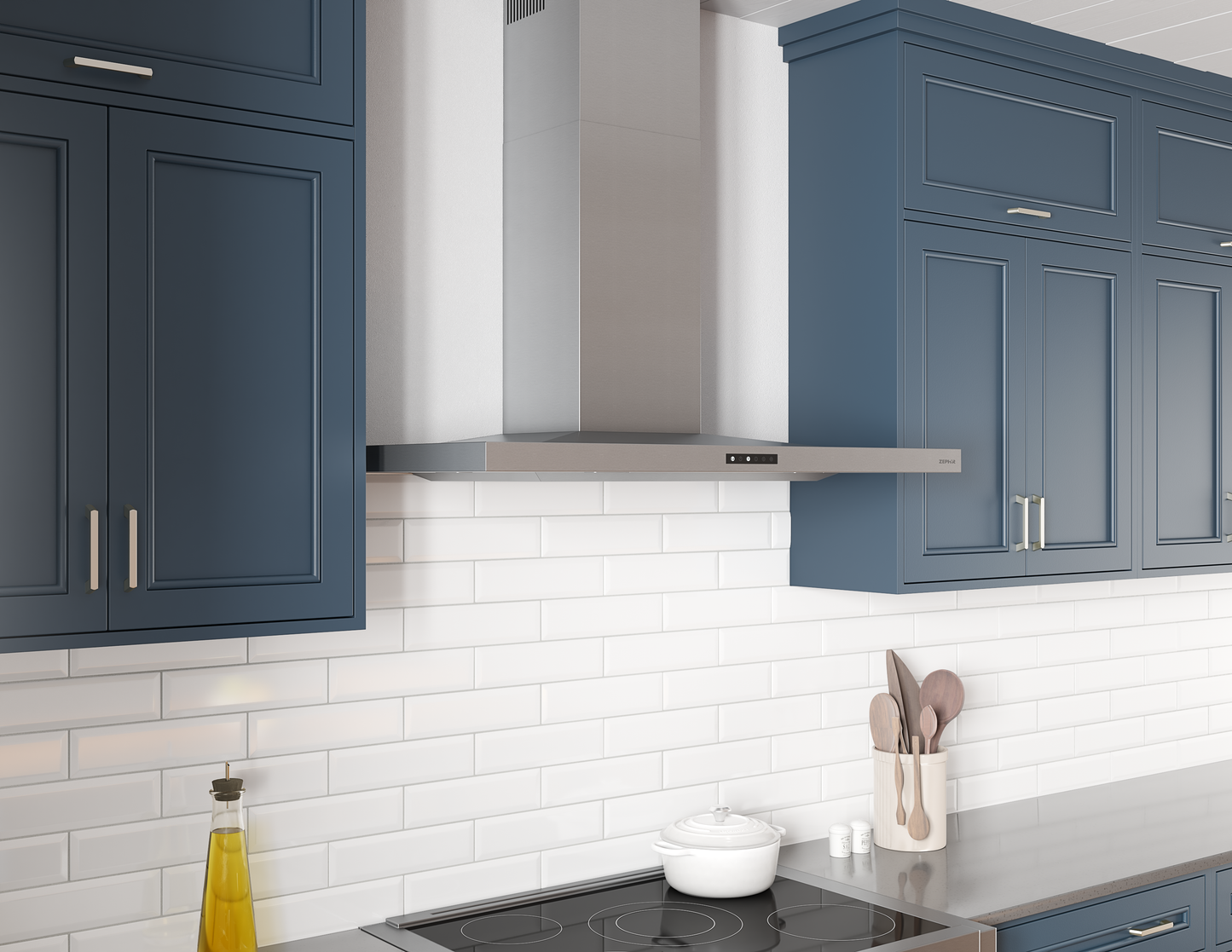 Stainless steel wall-mounted range hood with clean lines and sleek modern design in kitchen with blue cabinetry and white subway tile