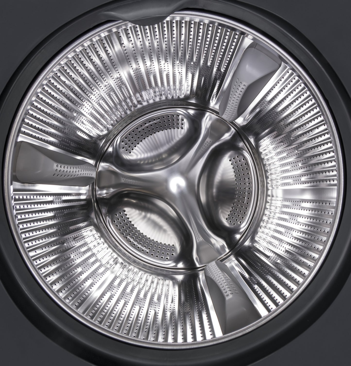 Stainless steel drum interior of front load washer from washers and appliances collection with perforated design