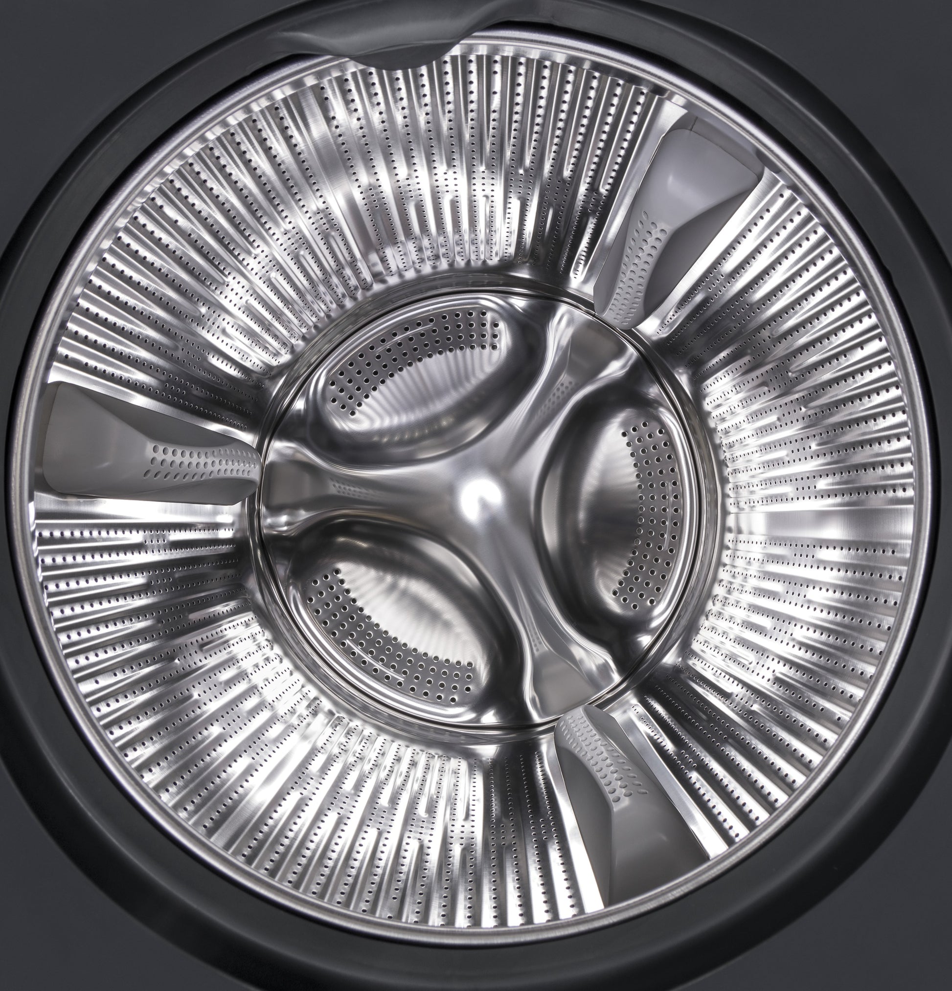 Stainless steel drum interior of front load washer from washers and appliances collection with perforated design