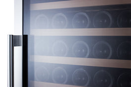 Modern refrigerator appliance with glass door showing wooden slide-out shelves storing multiple wine bottles inside
