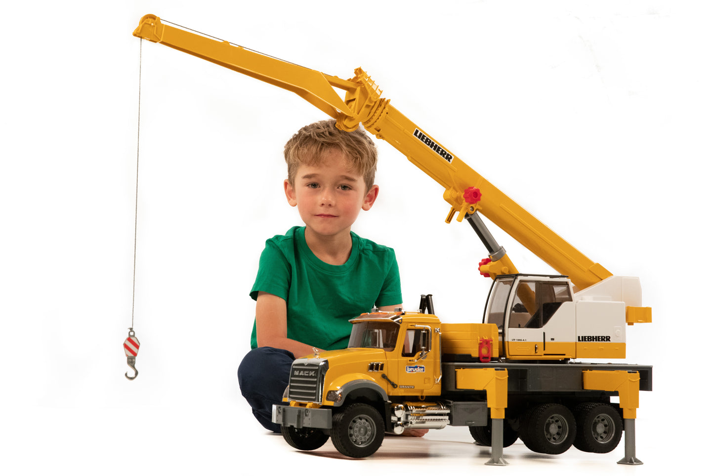 Child playing with Bruder MACK Granite Liebherr crane truck model in Vehicles & Remote Controlled Toys collection