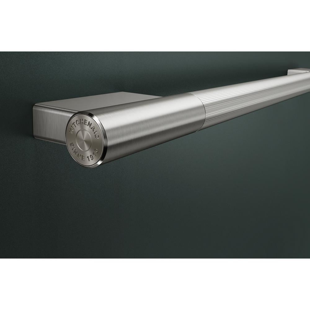 Stainless steel towel bar handle with textured grip detail from KitchenAid appliances and kitchenware collections