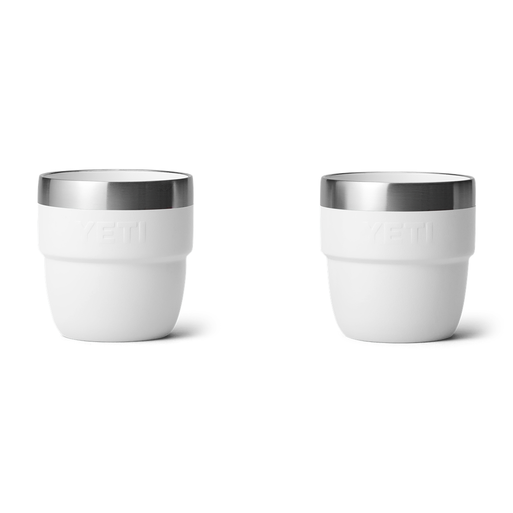 Two white stackable 4 oz. insulated cups with stainless steel rims for durable use in kitchen and drinkware collections