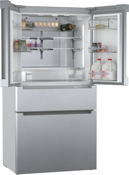 Open stainless steel French door refrigerator with glass shelves and organized storage in Bosch appliance collection