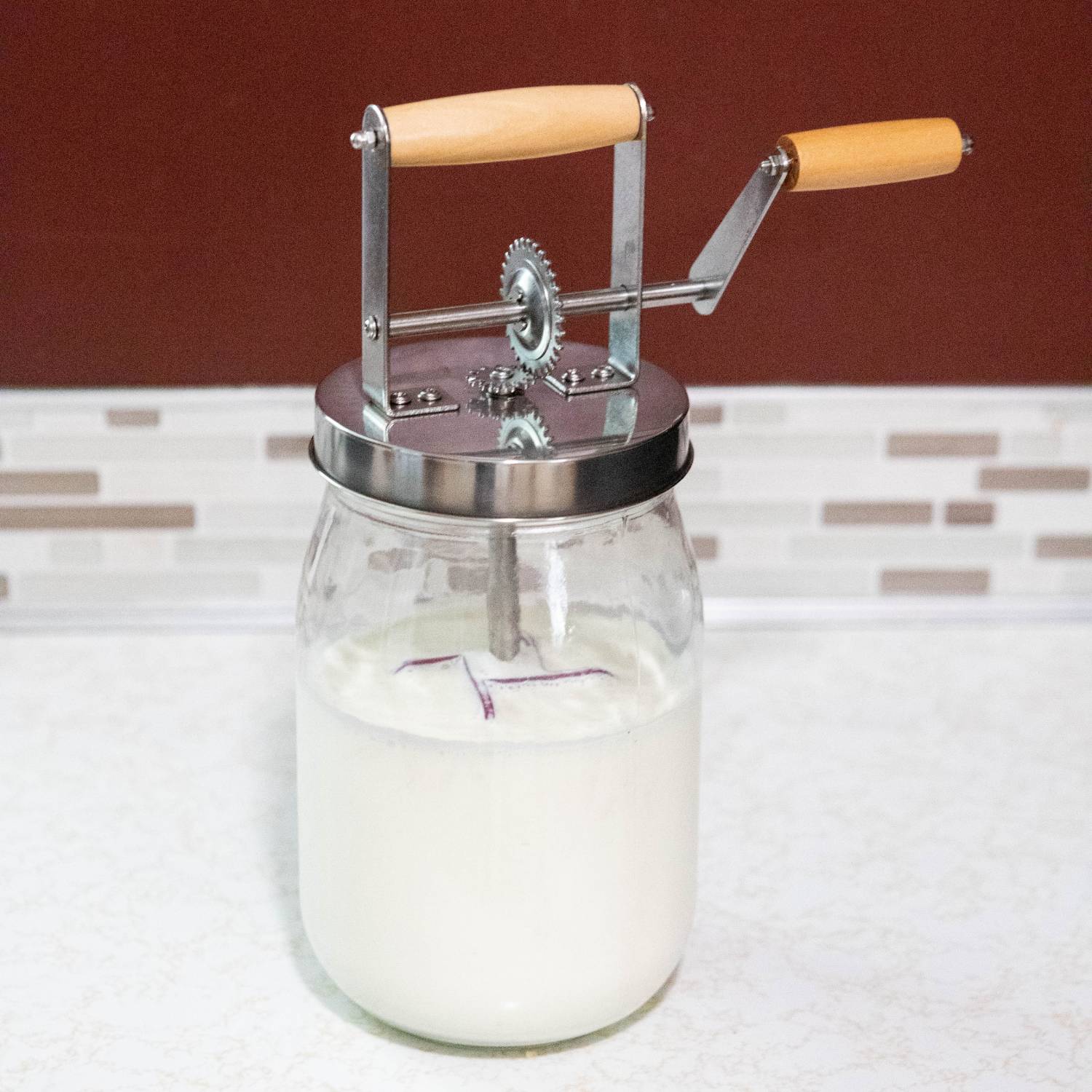 Compact glass butter churn with wooden handles and stainless steel mechanism in Small Kitchen Appliances and Kitchenware collections