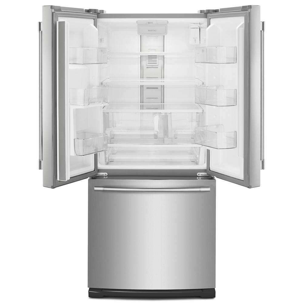 Open stainless steel French door refrigerator with spacious clear shelves and bottom freezer in kitchen appliances collection