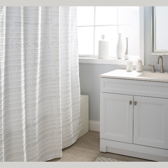 White polyester shower curtain with subtle dotted backstitch pattern in a bright bathroom setting