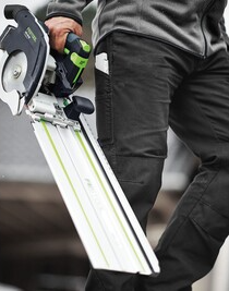 Person holding a cordless carpentry saw with guide rail, part of Festool cordless tools and power tools collections