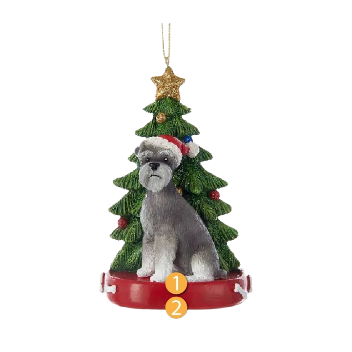 Ornament featuring a gray schnauzer in Santa hat seated before a decorated Christmas tree with gold star topper