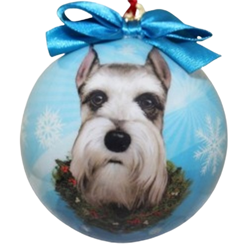 Blue Christmas ball ornament featuring a hand-painted schnauzer face with festive wreath and bow decoration