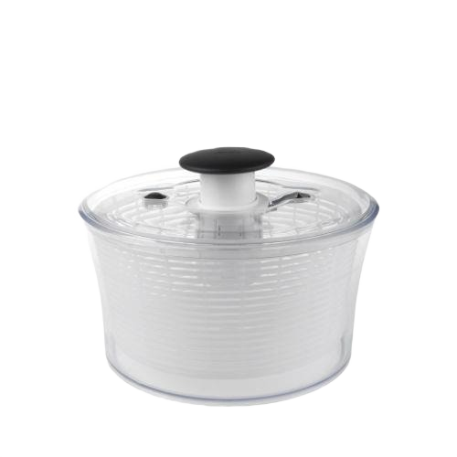 Compact clear plastic salad and herb spinner with black push button, ideal for kitchenware and meal prep tasks