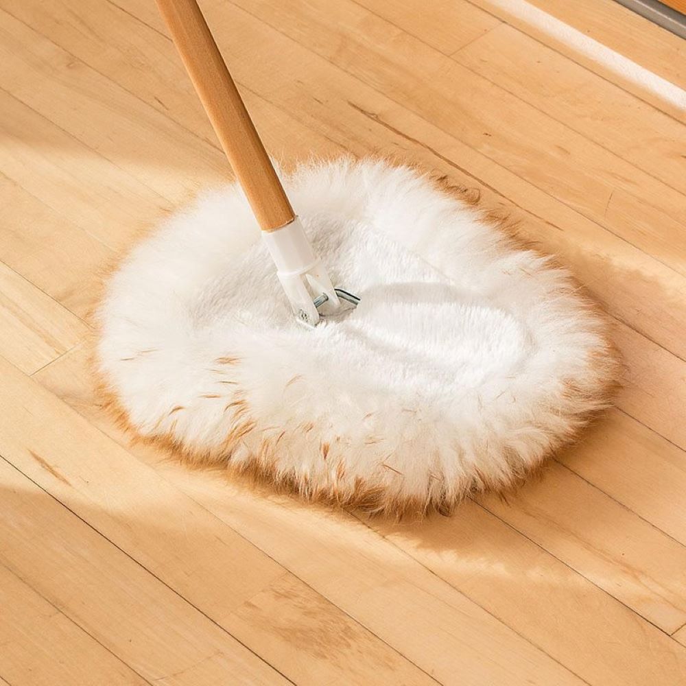 Soft lamb's wool wedge mop head with wooden handle on hardwood floor in cleaning tools and mop buckets collection