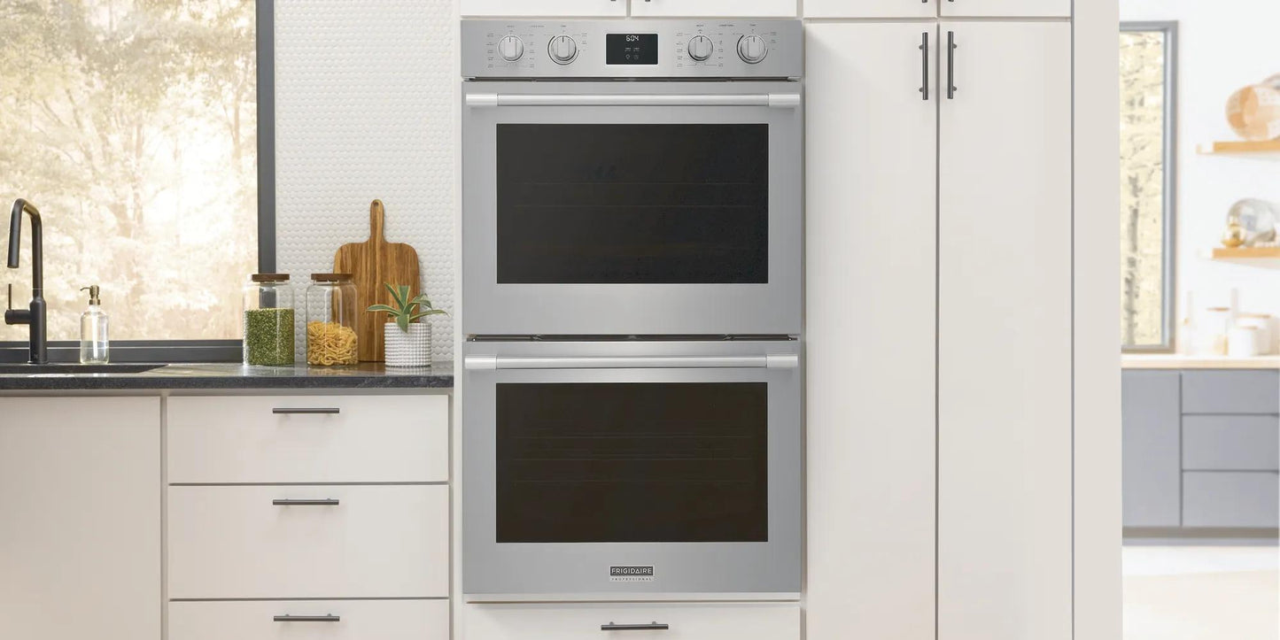 Stainless steel 30" double wall oven with digital display and control knobs in modern kitchen setting