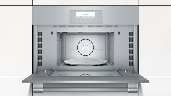 Built-in stainless steel microwave with open door, digital display, and glass turntable for kitchen appliances