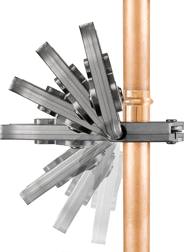 Set of black pivoting press rings positioned on copper tubing for precise tool alignment in home improvement tasks