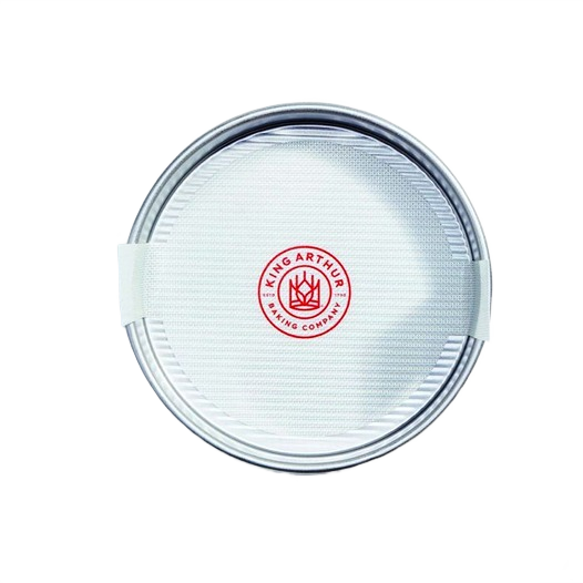 Round silicone loaf lifter with natural glass fibers, textured surface, and red logo for kitchenware and bakeware collections