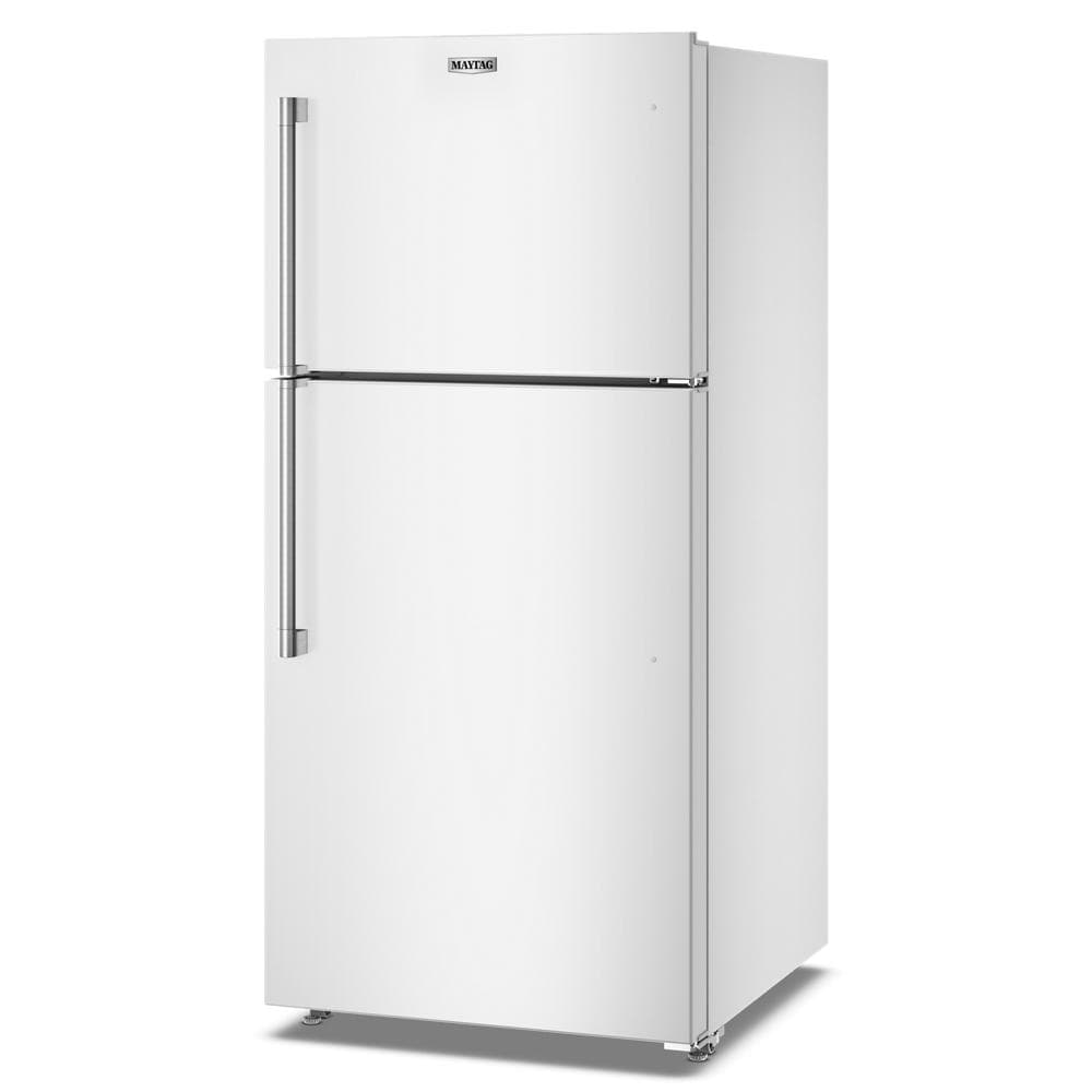 White top-freezer refrigerator with stainless steel handles standing in a plain white background environment