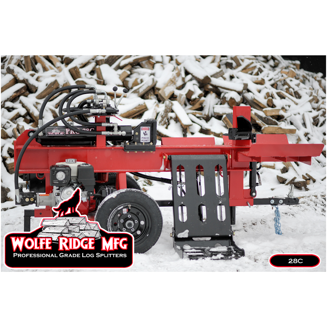 Red Wolfe Ridge commercial log splitter with hydraulic system and gas engine on snow-covered ground near firewood pile
