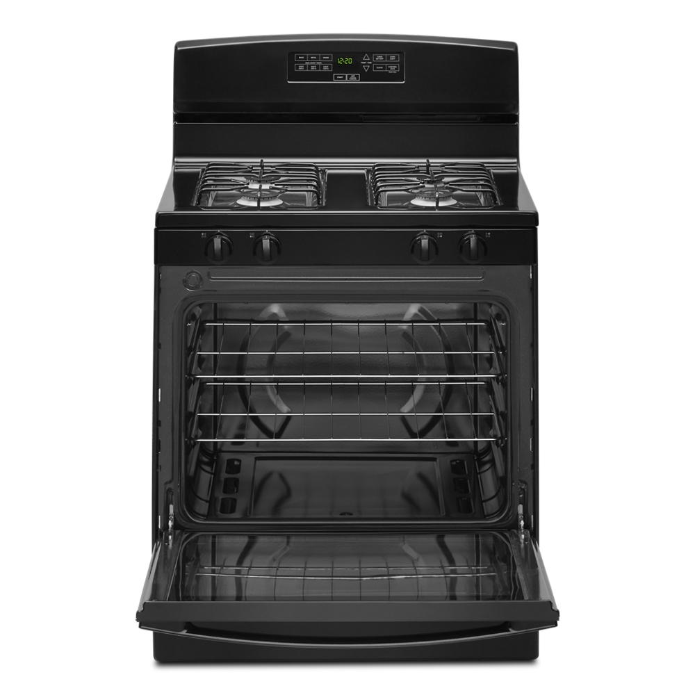 Black 30-inch gas range with open oven door, control knobs, and digital display in kitchen appliance collection
