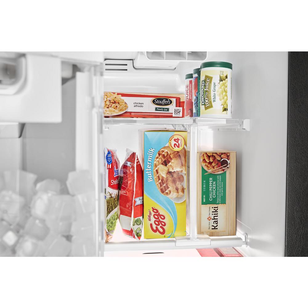 Inside freezer compartment stocked with frozen waffles, ice cream, and frozen snacks in kitchen appliance setting