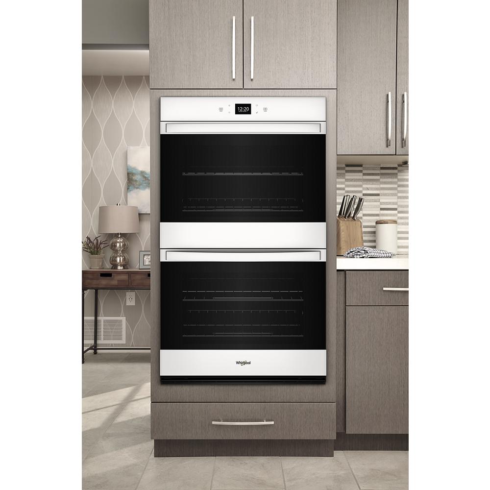 White built-in double wall oven with digital display and modern cabinetry in kitchen appliances at Hartville Hardware