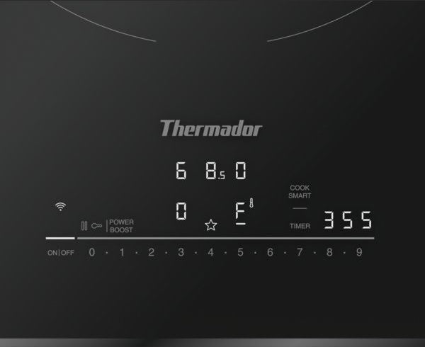Close-up of a black induction cooktop control panel with digital display and touch slider from Appliances collection