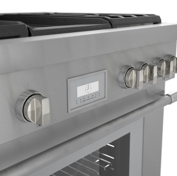 Close-up of stainless steel gas range control panel with knobs and digital clock display in kitchen appliances collection