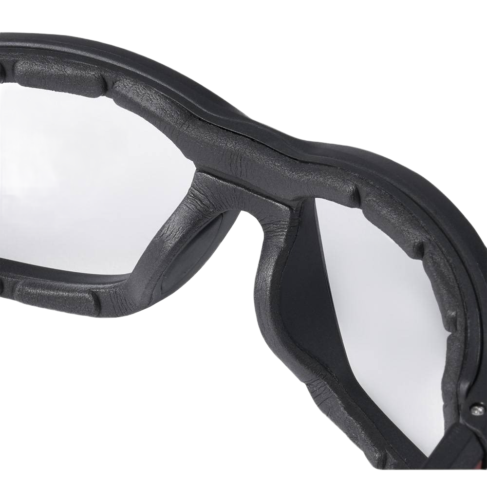 Close-up of clear lens safety glasses with black cushioned gasket for protective use in tools and home improvement tasks