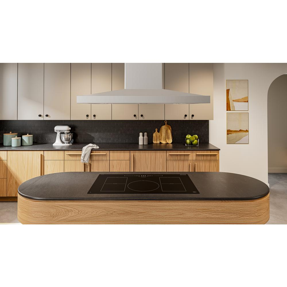Modern kitchen with a 42-inch island-mount canopy hood, wooden island cooktop, and beige cabinetry in a home improvement setting