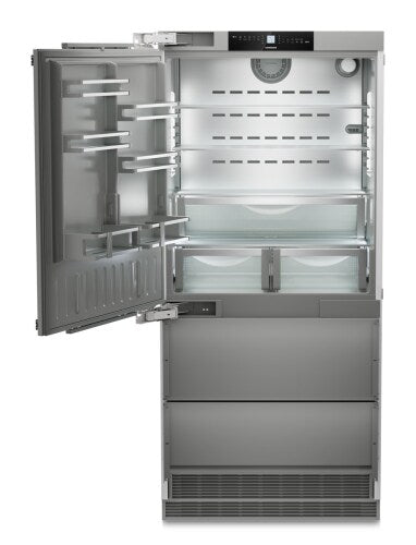 Built-in stainless steel refrigerator/freezer with open door showing spacious adjustable shelves in kitchen appliances collection