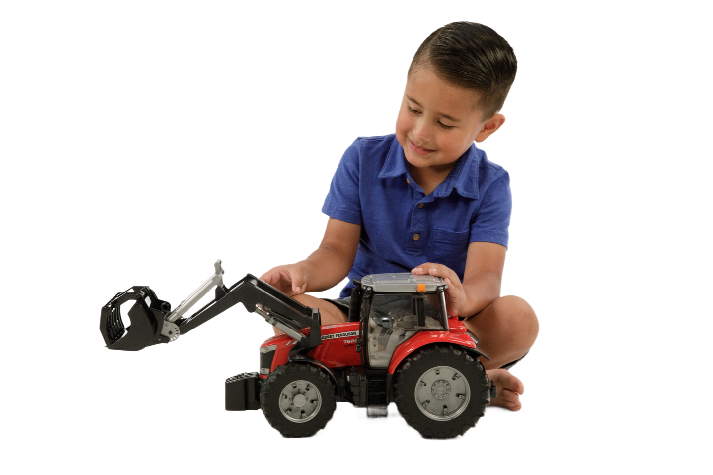 Child playing with a detailed red Bruder Massey Ferguson 7624 tractor toy in Vehicles & Remote Controlled Toys collection