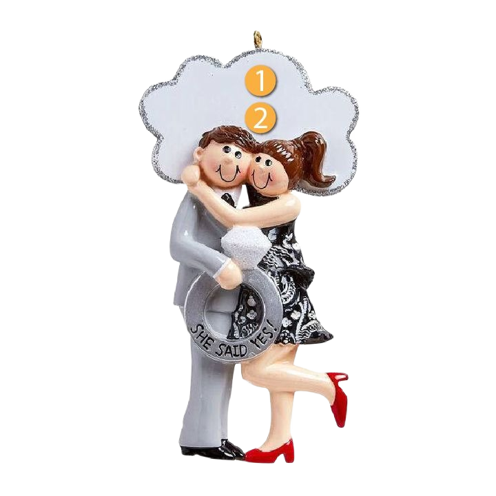 Ornament featuring a smiling brunette couple embracing with large engagement ring from Christmas Ornaments collection