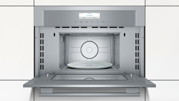 Open built-in stainless steel microwave with glass touch controls and digital display in modern kitchen appliances collection