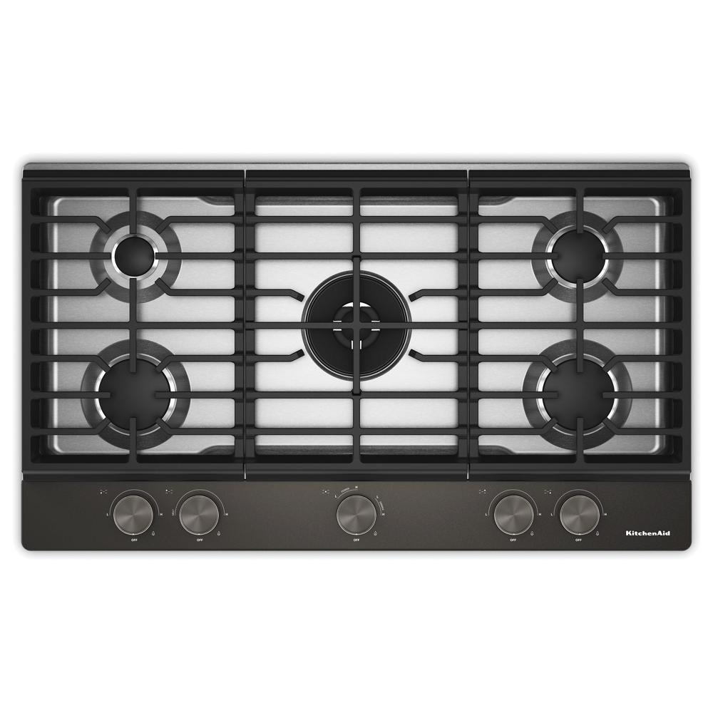 Top view of a black 36-inch gas cooktop with five burners, integrated wok grate, and premium weighted knobs, part of Cooktops and Gas Cooktops collections for home improvement.