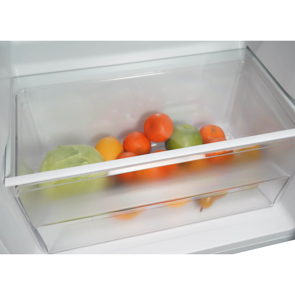 Clear refrigerator crisper drawer with assorted fresh fruits and vegetables in kitchen appliance setting
