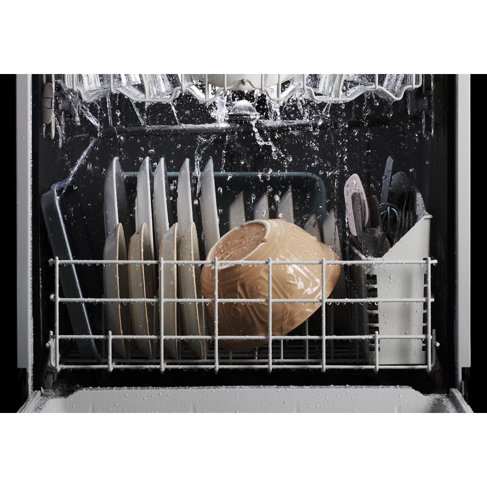 Dishes, utensils, and cups being sprayed with water inside a dishwasher for kitchen and home improvement tasks