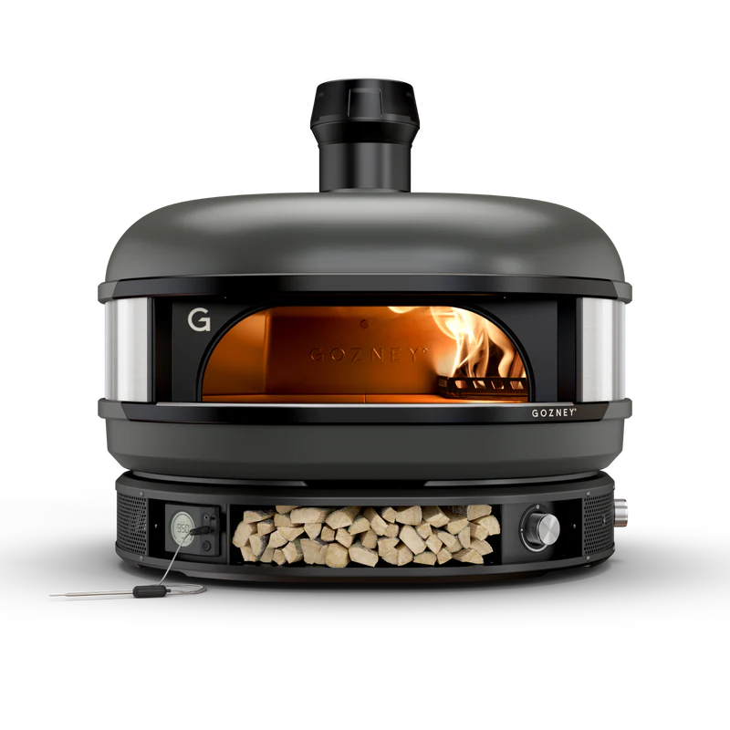 Black outdoor pizza oven with wood storage, digital controls, and visible flame for grilling and lawn & garden use