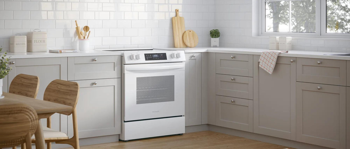 Modern kitchen featuring a white front control electric range surrounded by light gray cabinetry and natural wood flooring