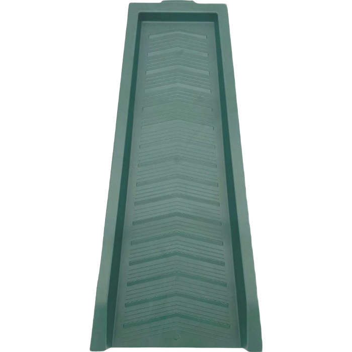 Green chevron-patterned splash block designed for home improvement drainage and water redirection tasks
