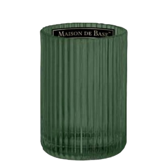 Green ribbed glass tumbler with vertical texture and a minimalist modern design for stylish home use