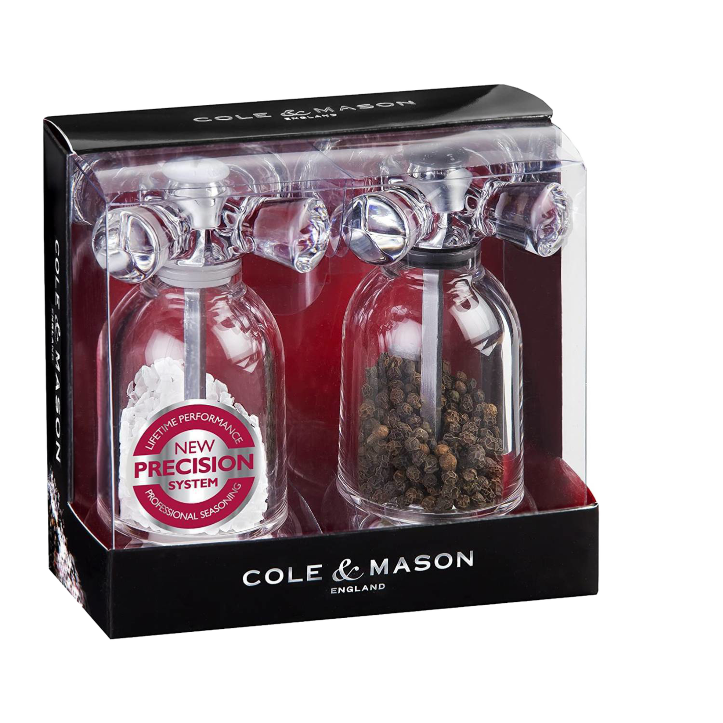 Clear acrylic salt and pepper mills with cross-handle tops in retail packaging for Kitchenware and Home Improvement collections