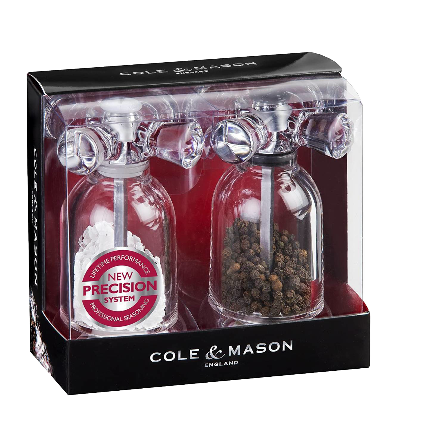Clear acrylic salt and pepper mills with cross-handle tops in retail packaging for Kitchenware and Home Improvement collections