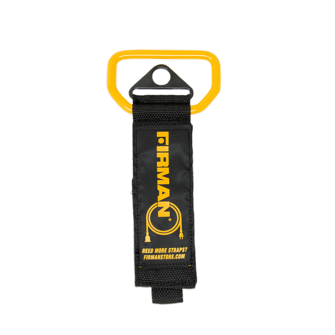 Heavy duty storage strap with yellow handle for securing and organizing tools in home improvement projects