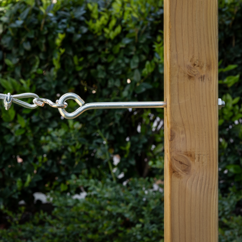 Zinc eye bolt with hex nut securing a chain to a wooden post for hardware and home improvement use under $50